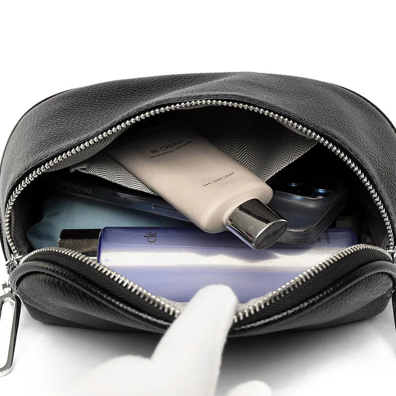 Women's soft PU leather messenger bag in saddle shape with cross-body strap, shown in green colour.