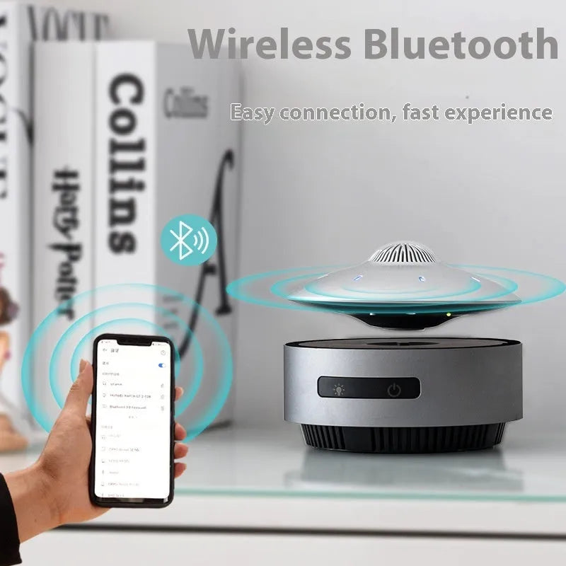 Black automatic lifting magnetic levitation Bluetooth speaker with a floating orb.