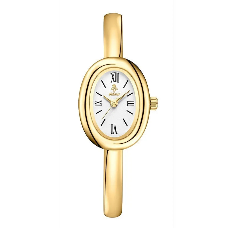 Women's slim oval retro quartz watch in gold colour on wrist