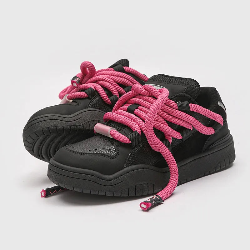 Casual low-top lace-up shoes in a solid colour with a round toe and thick rubber sole.