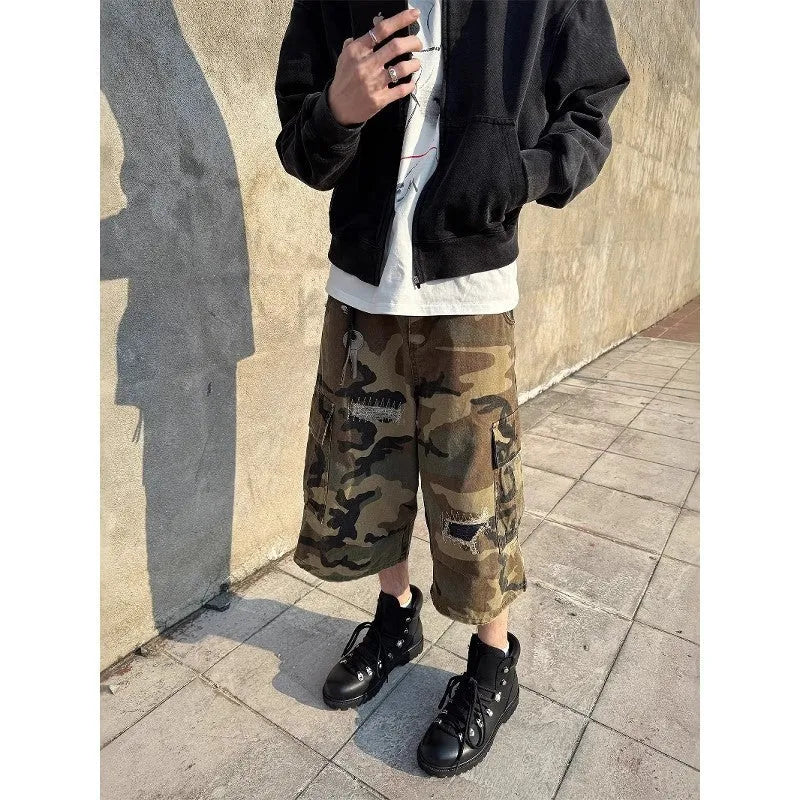 Men's camouflage cropped jeans with patch detailing and ripped accents in straight leg style