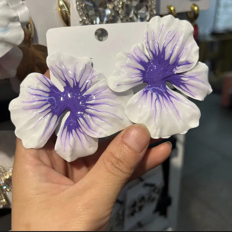 A pair of pastoral style alloy stud earrings with oil-spot glaze floral design in one of four colours.