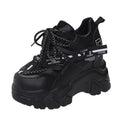 White women's low-top platform sports shoes with breathable mesh, cross strap, and rubber sole.