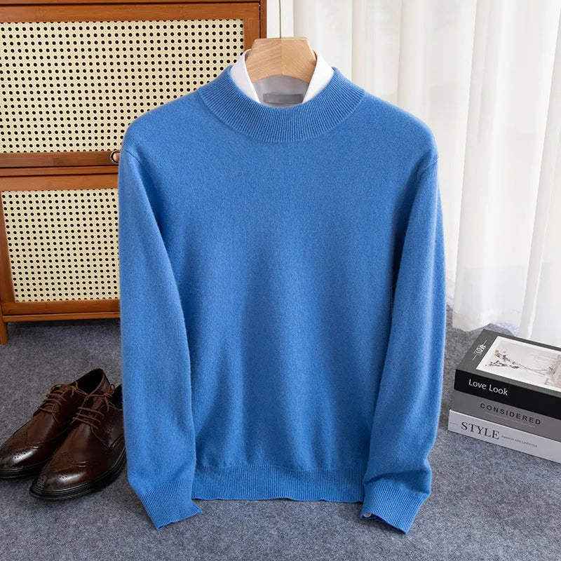 Man wearing a half-collar loose wool sweater in a textured rough yarn knit.
