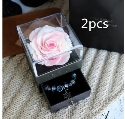 Eternal Flower gift box with preserved roses and carnations inside, measuring 8.5 cm square by 10.5 cm high