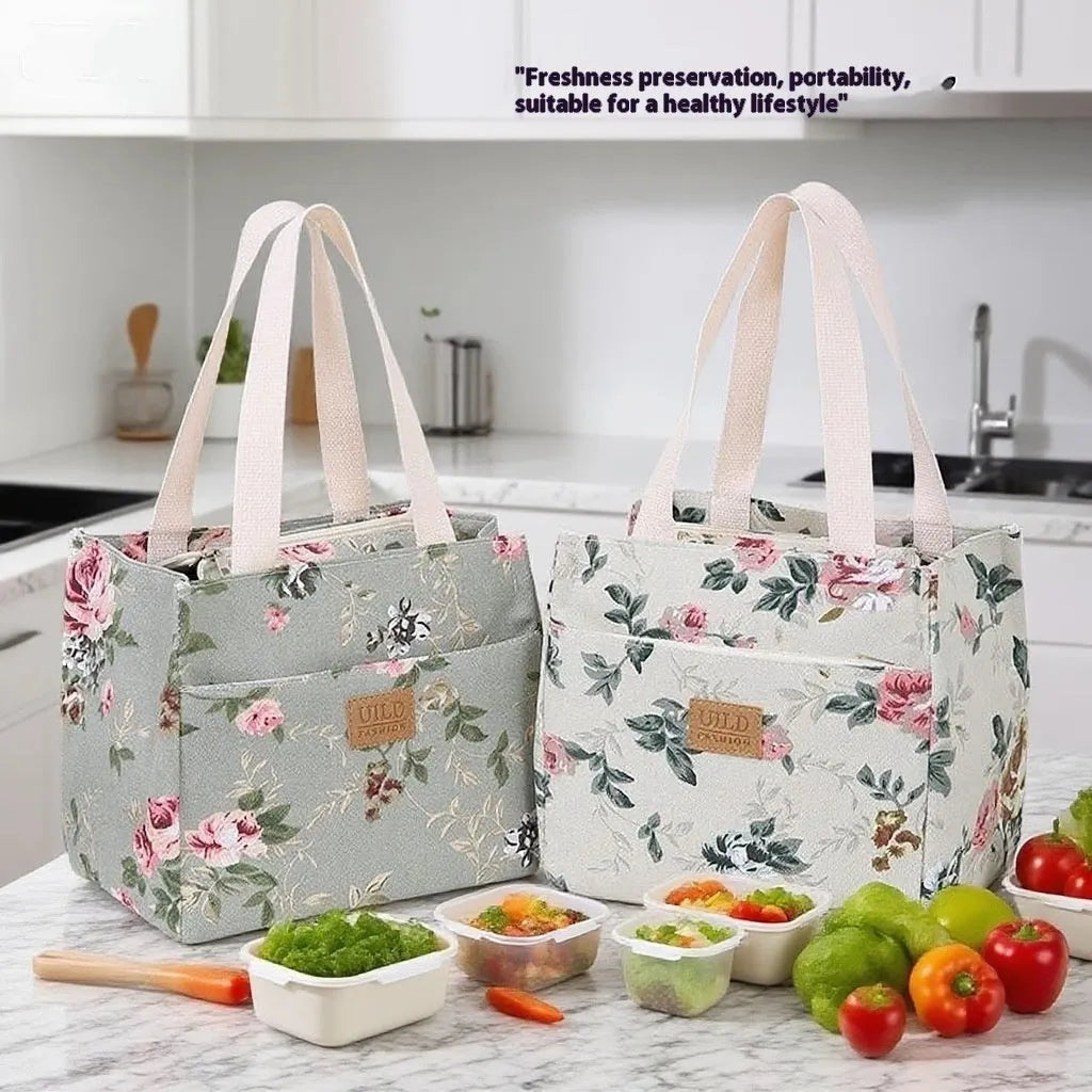 Women's printed canvas tote bag with aluminium frame showing horizontal square shape and floral pattern design