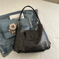 Women's PU leather shoulder bag in horizontal square shape with single strap, showing interior mobile phone compartment
