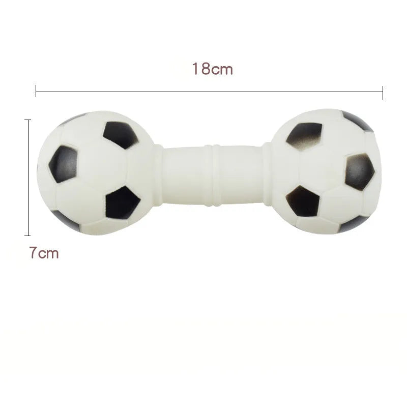 Brown orange white yellow PVC football dumbbell shaped squeaky dog chew toy on a plain background.
