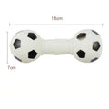 Brown orange white yellow PVC football dumbbell shaped squeaky dog chew toy on a plain background.