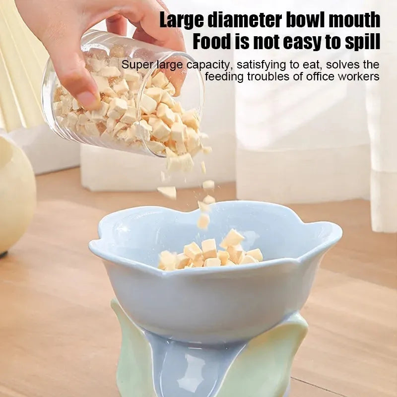 Blue floral patterned ceramic raised pet bowl with non-slip base for cats or small dogs.