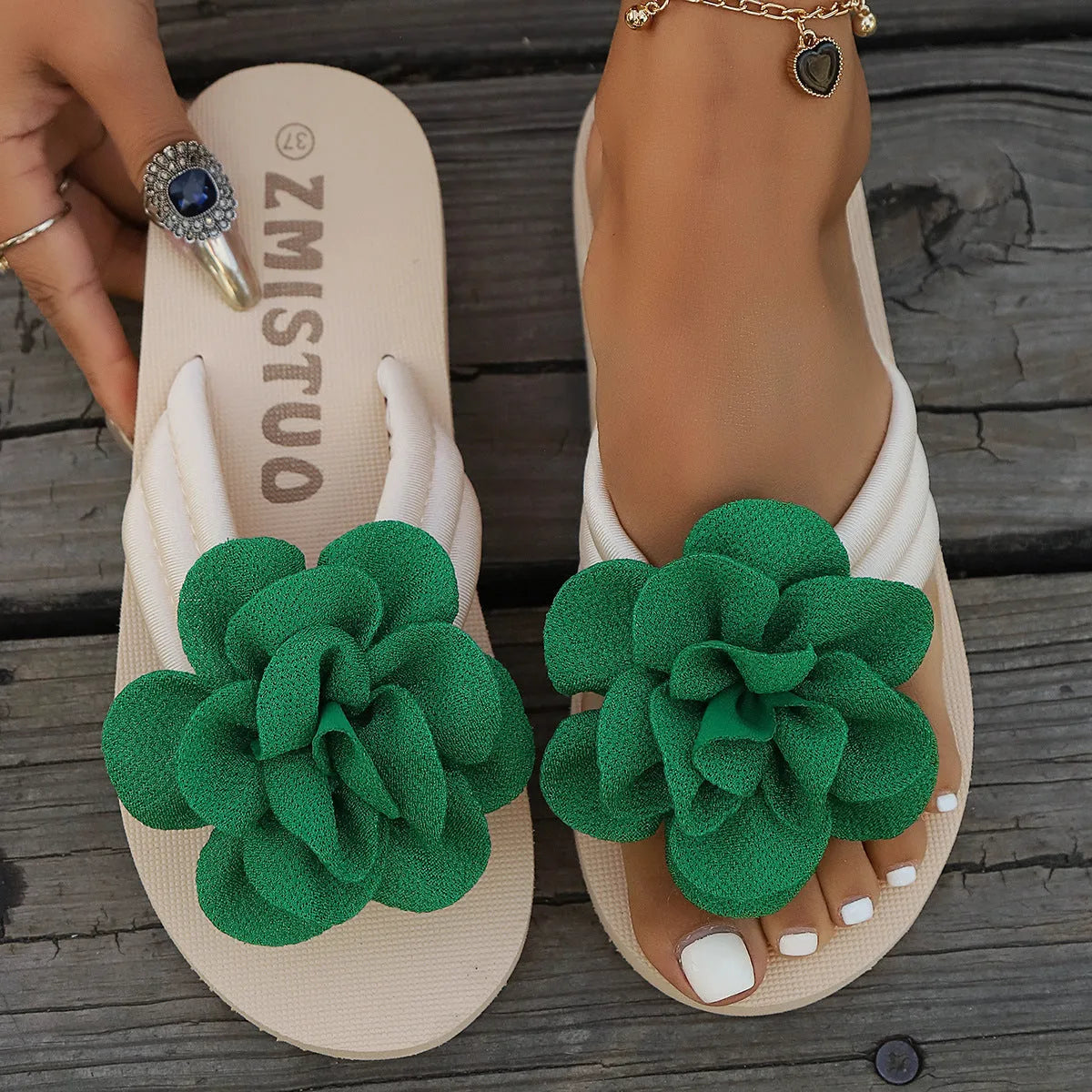 Women's floral pattern PU slippers in beige, shown in a casual flip-flop style with a round toe.