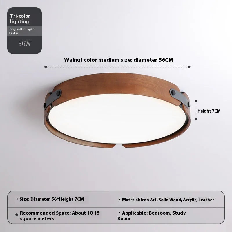 Japanese style wooden ceiling lamp with a round PMMA lampshade in warm light colour.