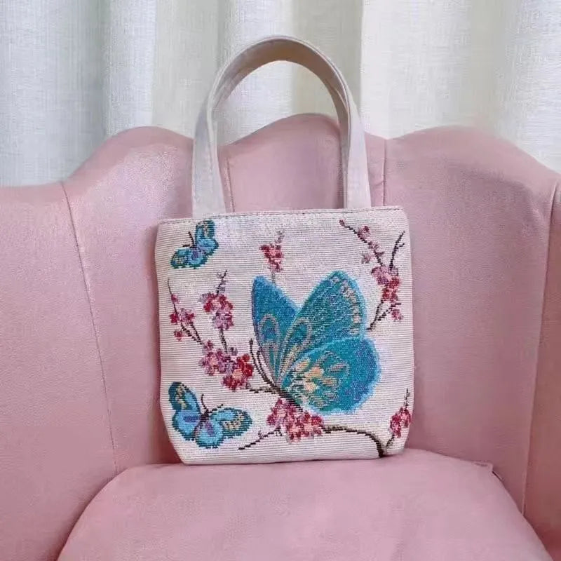 Double-sided gold wire embroidery canvas handheld bag showing decorative detailing