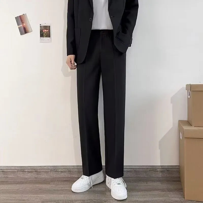 Plus size men's college style suit set with jacket, trousers, white shirt, and tie in loose fit