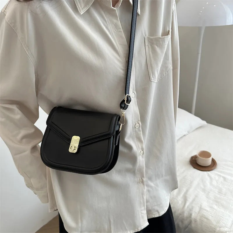 Soft PU leather horizontal square messenger bag with clamshell opening in khaki colour.