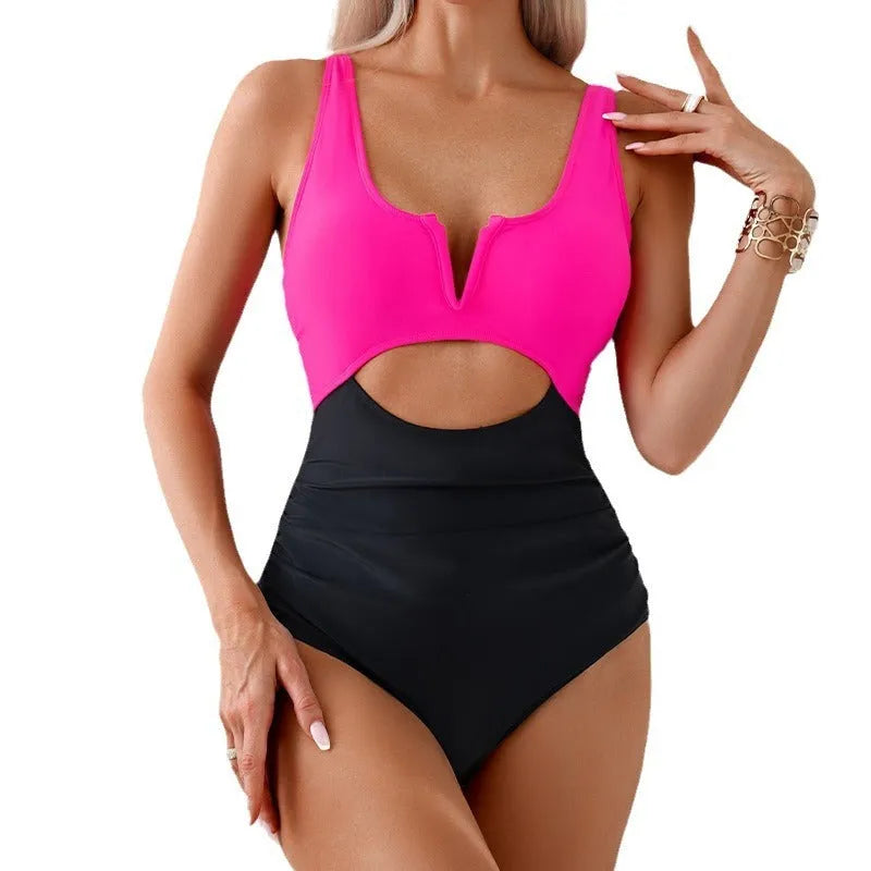 Women's one-piece swimsuit with contrast colour panels in green, black, dark pink or brown.