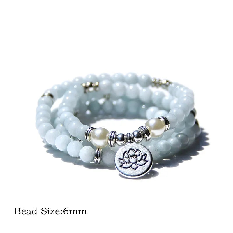 Vintage natural stone bracelet for women with a geometric lotus pendant on a model's wrist.
