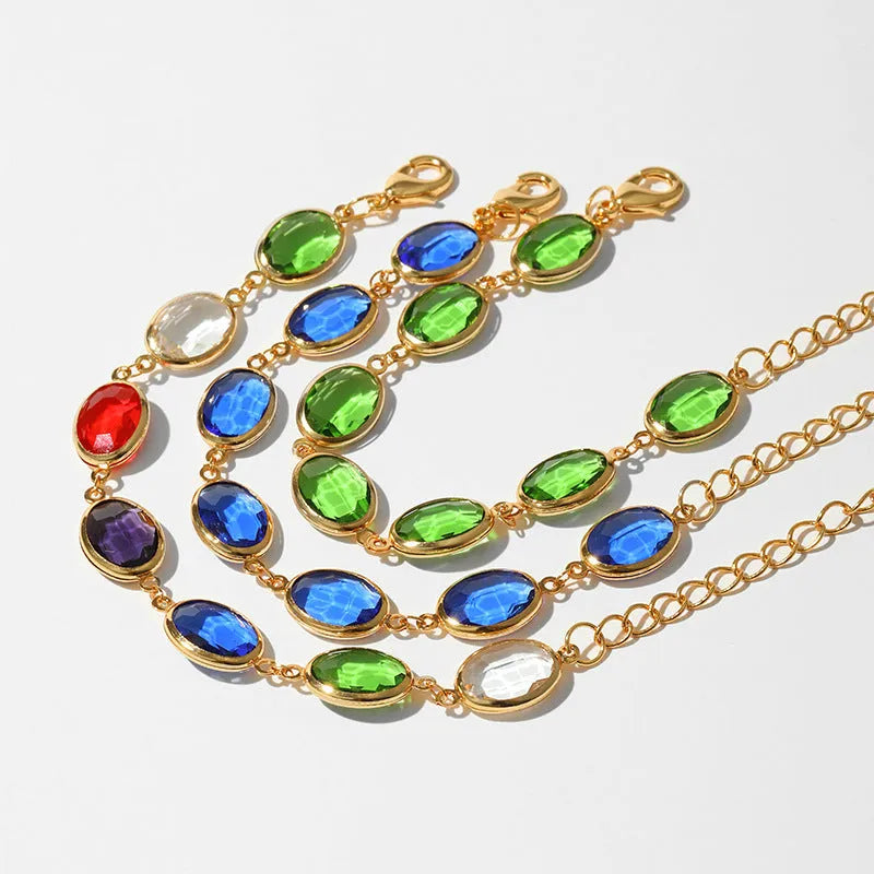 Women's geometric bracelet with elliptical glass inlays on 18K gold-copper framework