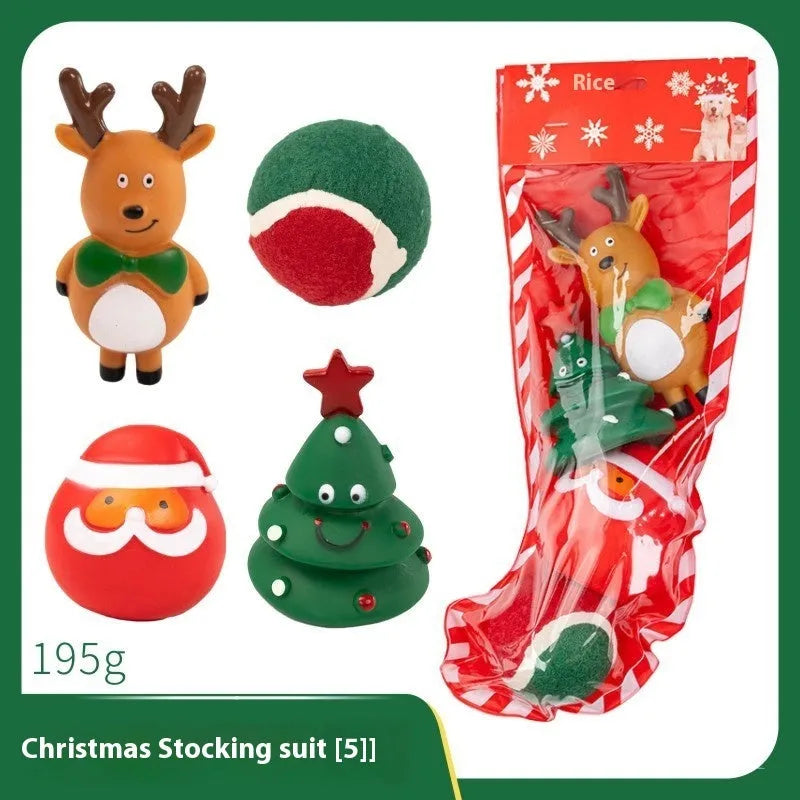 Seven Christmas gift bags containing vinyl dog toys with Santa heads, trees and deer figures