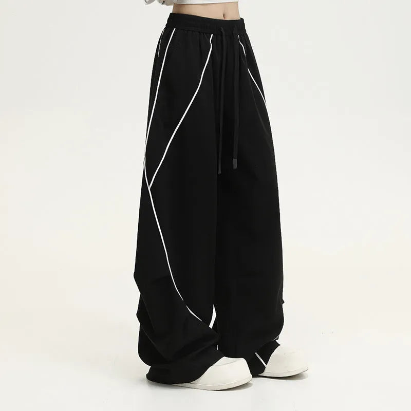 Black pleated wide-leg hip hop trousers with striped pattern and mid-waist design