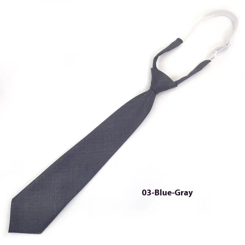 Solid navy blue men's cotton tie with arrow-type design on a white background.