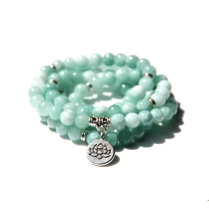 Vintage natural stone bracelet for women with a geometric lotus pendant on a model's wrist.