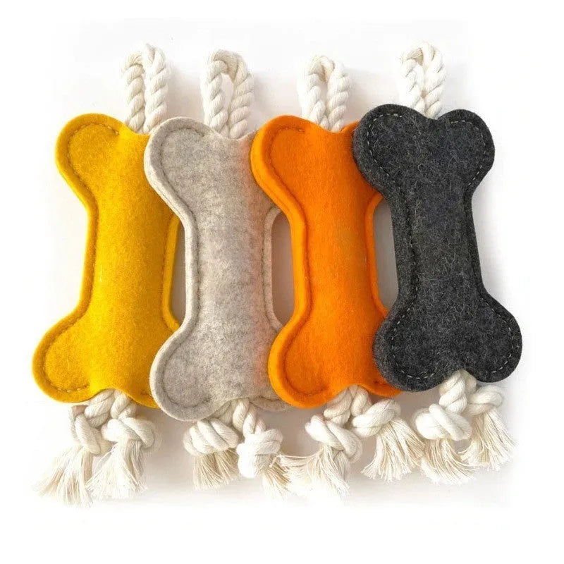 Bone-shaped dog chew toy in felt fabric with rope detailing, shown in various colours