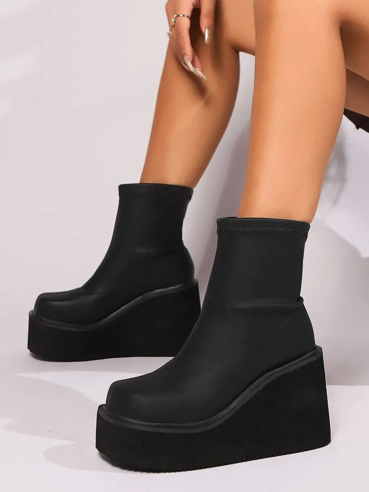 Plus size women's wedge heel boots with waterproof platform sole in black leather