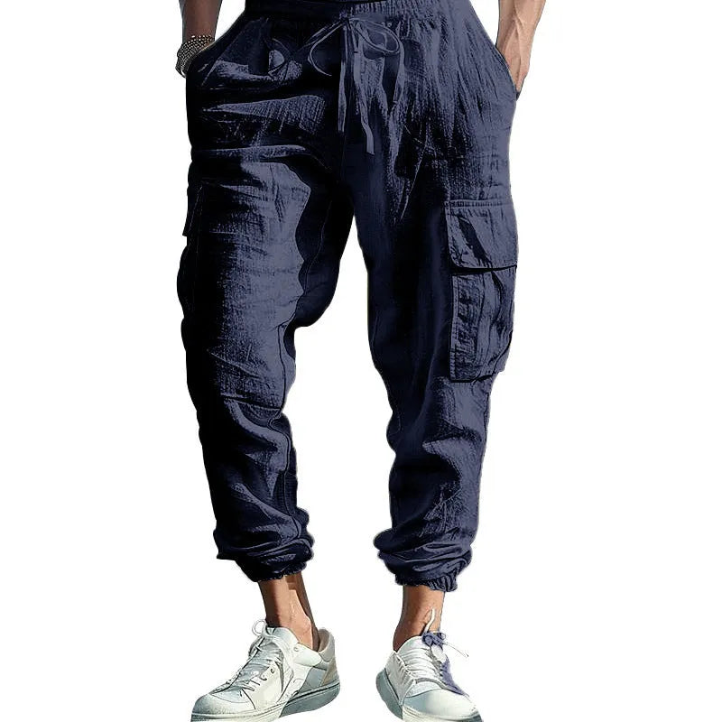 Men's linen casual trousers with ankle-tied design and multiple pockets in army green colour.
