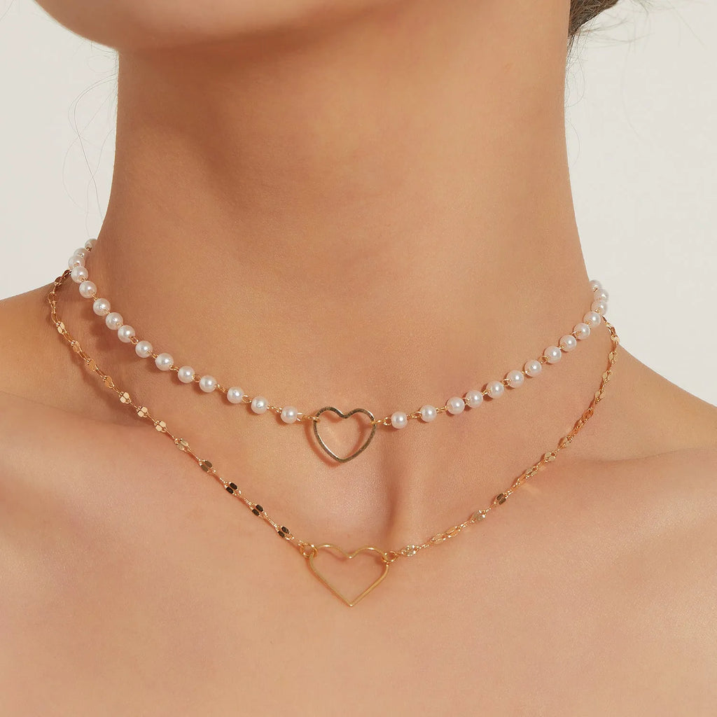 Gold heart-shaped zinc alloy pendant necklace on adjustable chain