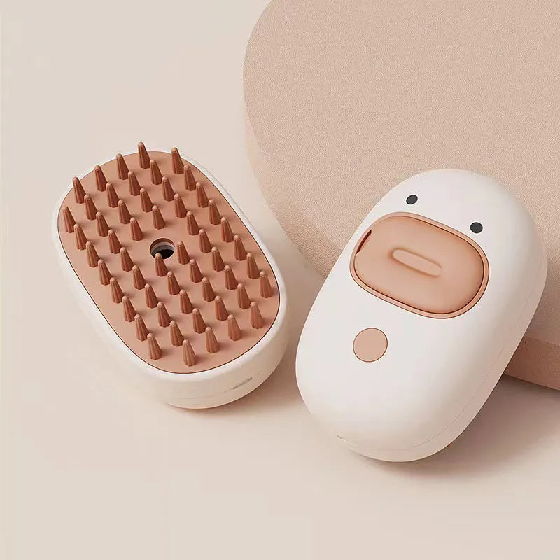 White and yellow silicone steam pet brush for grooming dogs and cats with a water tank.