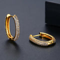 Pair of simple geometric copper earrings with electroplated finish in 18K gold option on white background