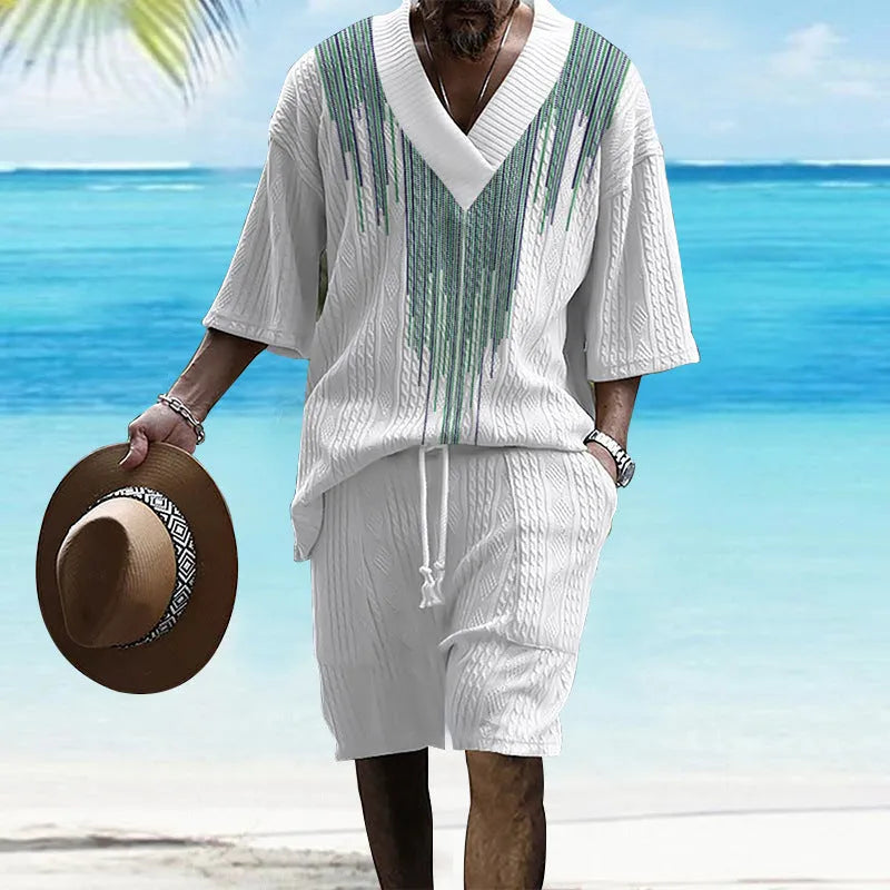 Printed men's knitted drop-shoulder short-sleeved top and matching shorts set in a polyester blend.