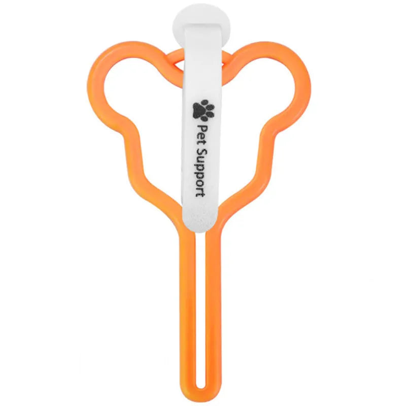 Hands-free dog poop bag holder with black velcro strap and clip attached to a dog leash.