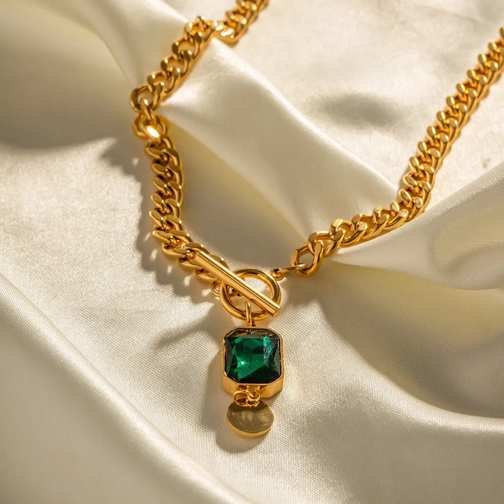 Gold titanium steel necklace with geometric emerald zircon pendant on Cuban link chain