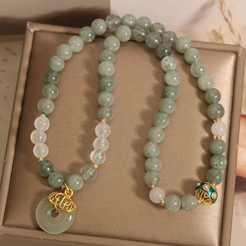 Women's double-layer aventurine jade bracelet with safety buckle and rhinestones.