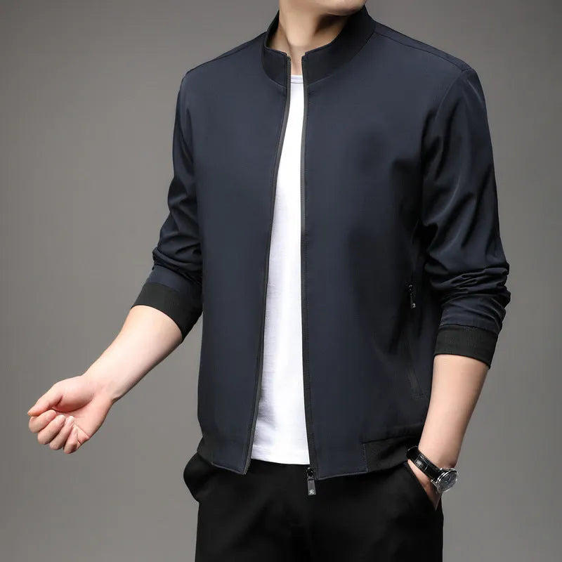 Man wearing a black Korean-style loose lapel casual jacket with zipper pockets.