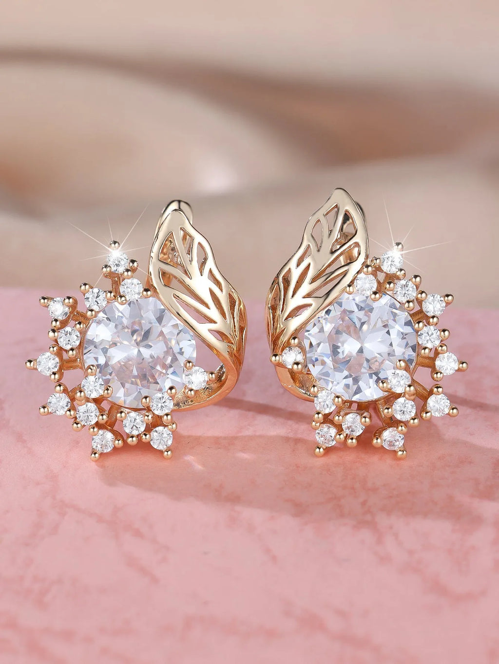 Round floral feather earrings in rose gold colour with crystal zircon stones, shown in six colour variations