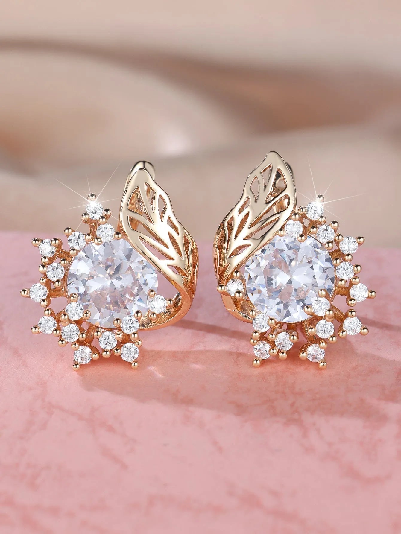 Round floral feather earrings in rose gold colour with crystal zircon stones, shown in six colour variations