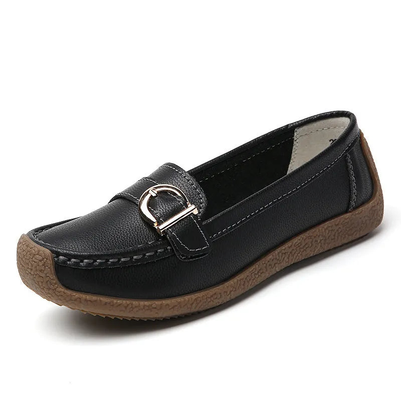 Women's casual flat loafers in artificial PU leather with a rounded toe and beef tendon sole.