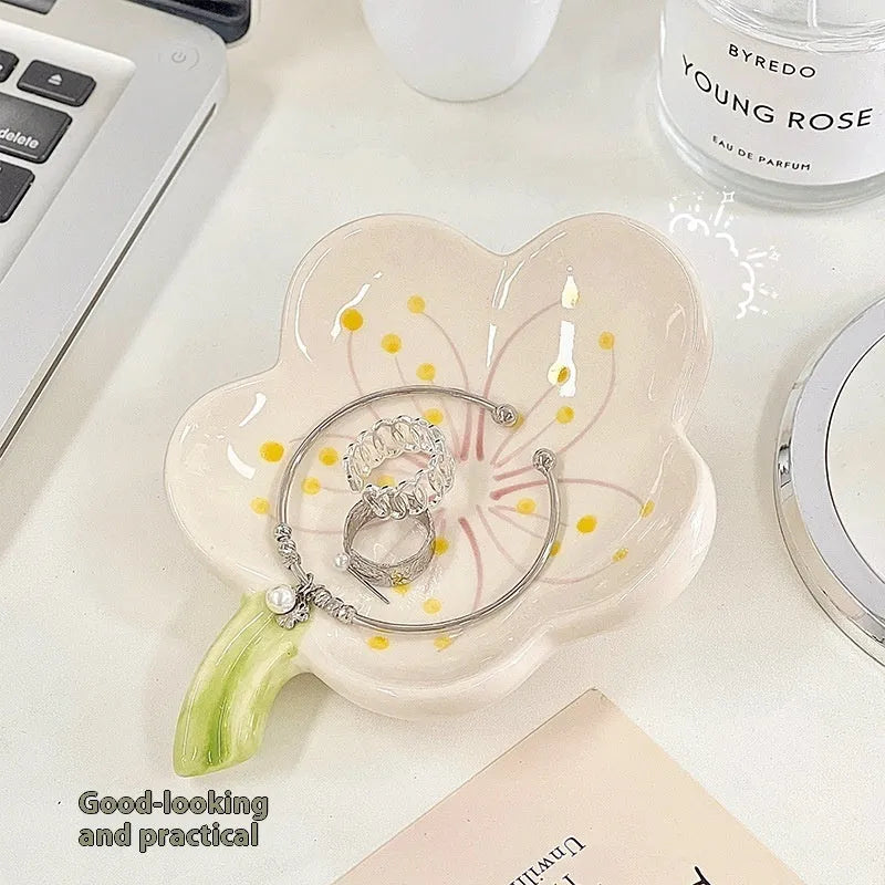 Yellow ceramic ornament tray with a small pink-shell night light placed on it, modern simple style.