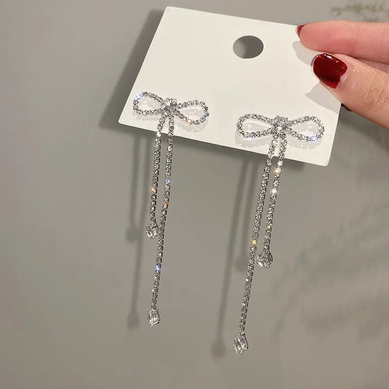 Fashion jewellery silver needle long bow tie full-jeweled stud earrings for women in gold and silver drop shape