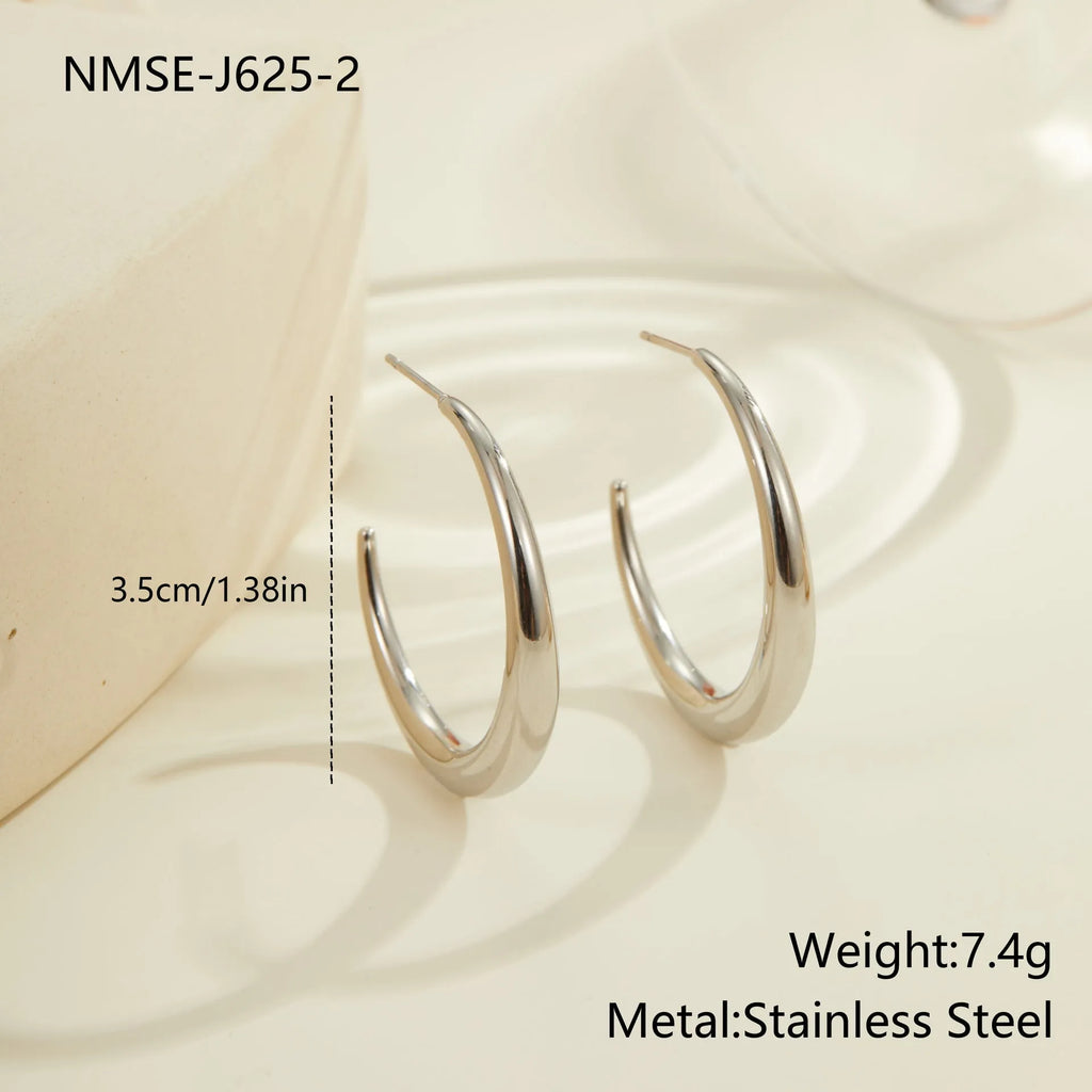 Simple round stainless steel hoop earrings for women in gold and steel colours, available in two sizes.