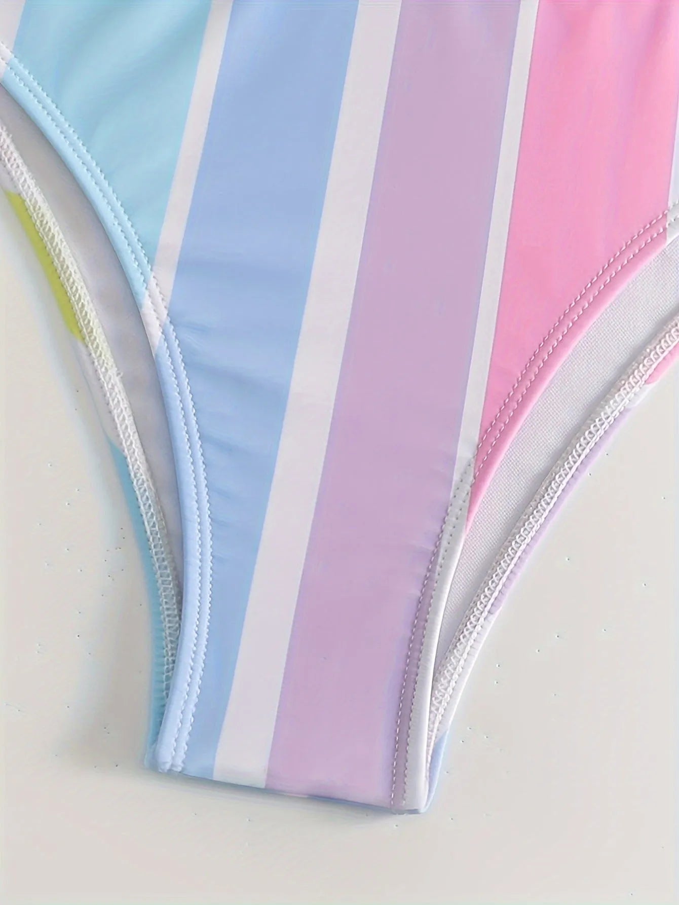 Women's striped bikini set with top and briefs for swimming and sports.