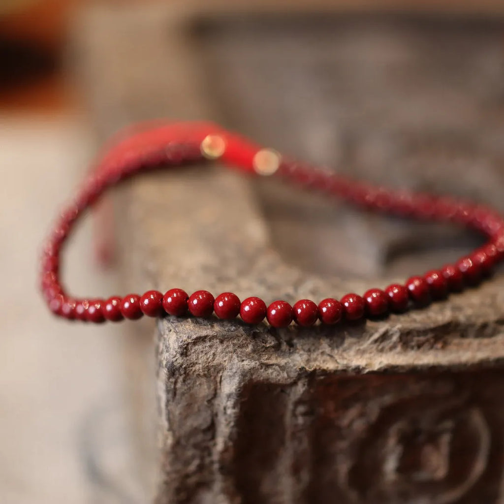 Handcrafted purple gold sand design cinnabar bracelet or anklet with geometric Chinese style patterns.
