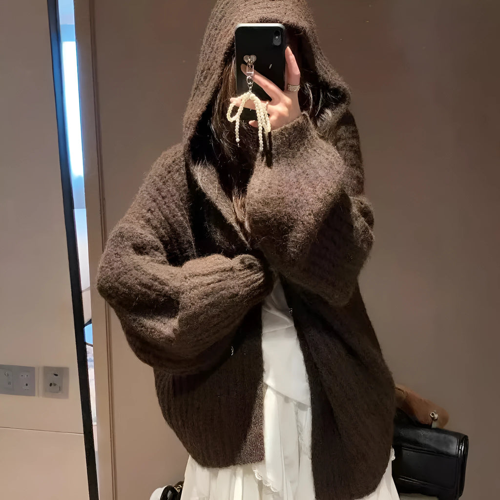Women's loose hooded cardigan in thick acrylic blend, shown in dark grey, brown, and milky white.
