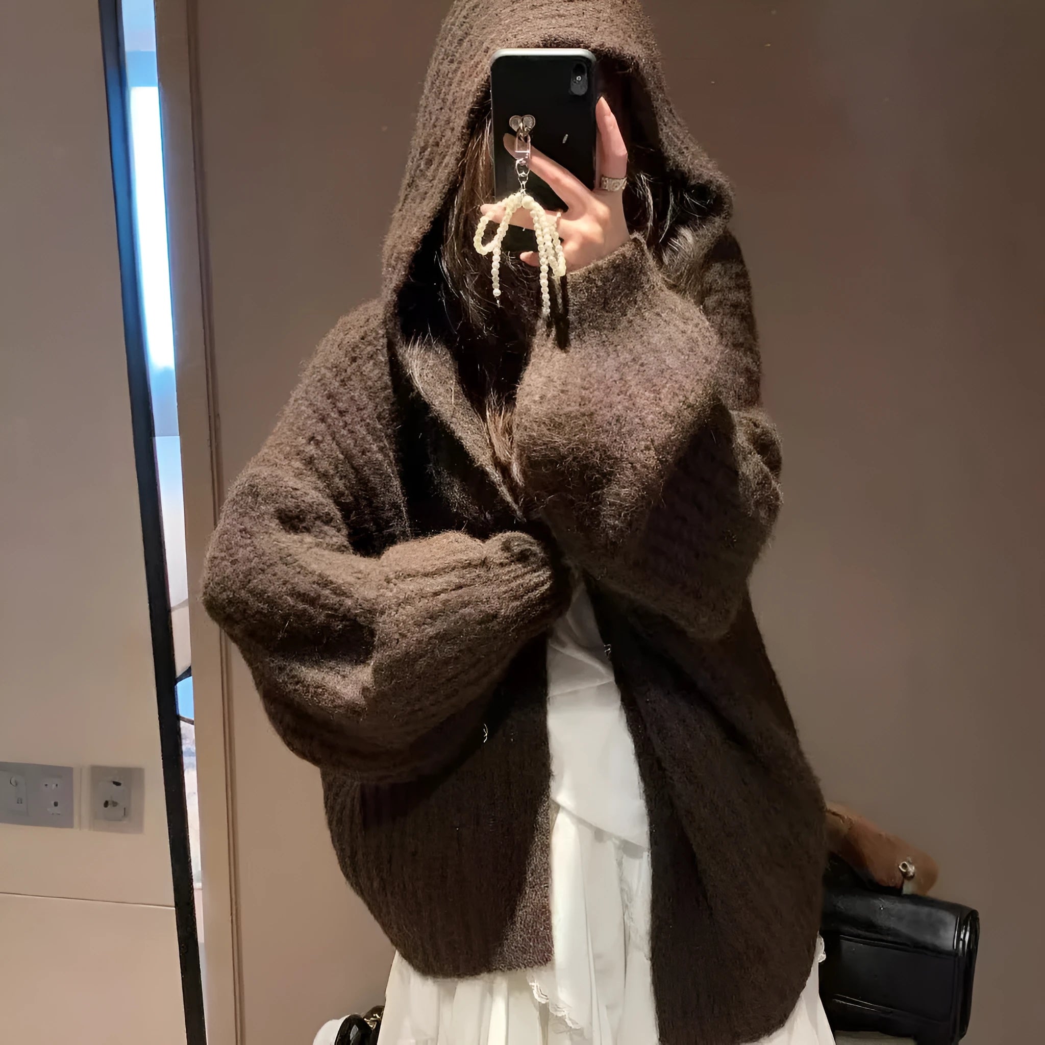 Women's loose hooded cardigan in thick acrylic blend, shown in dark grey, brown, and milky white.