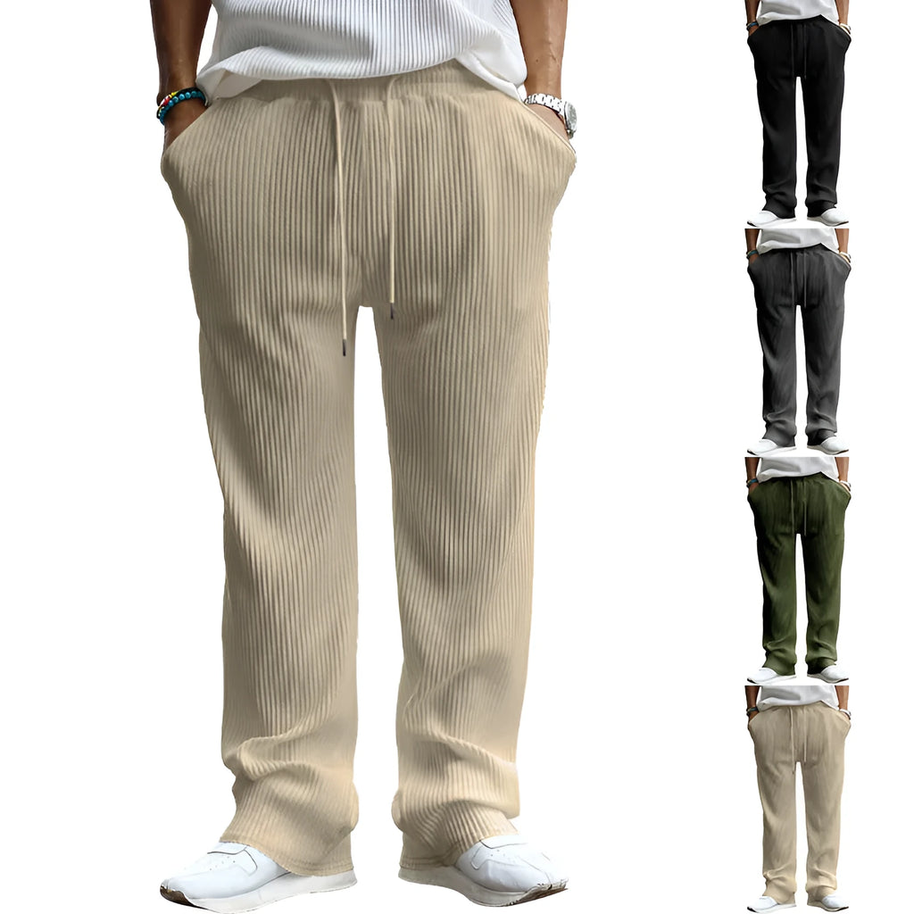 Man wearing casual loose-fit high-waist straight-leg striped trousers in a solid colour.
