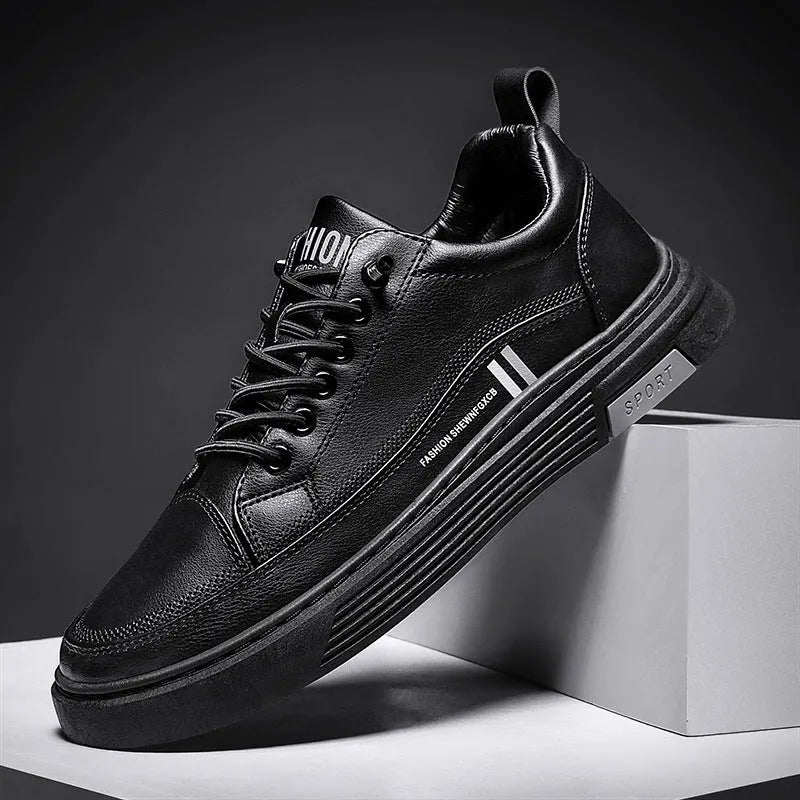 Men's white and black low-top skateboard shoes with elastic band fastening and rubber sole.