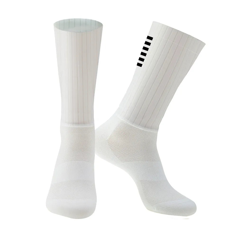 Pair of breathable chemical fibre blend athletic socks for cycling and running, shown in orange colour.